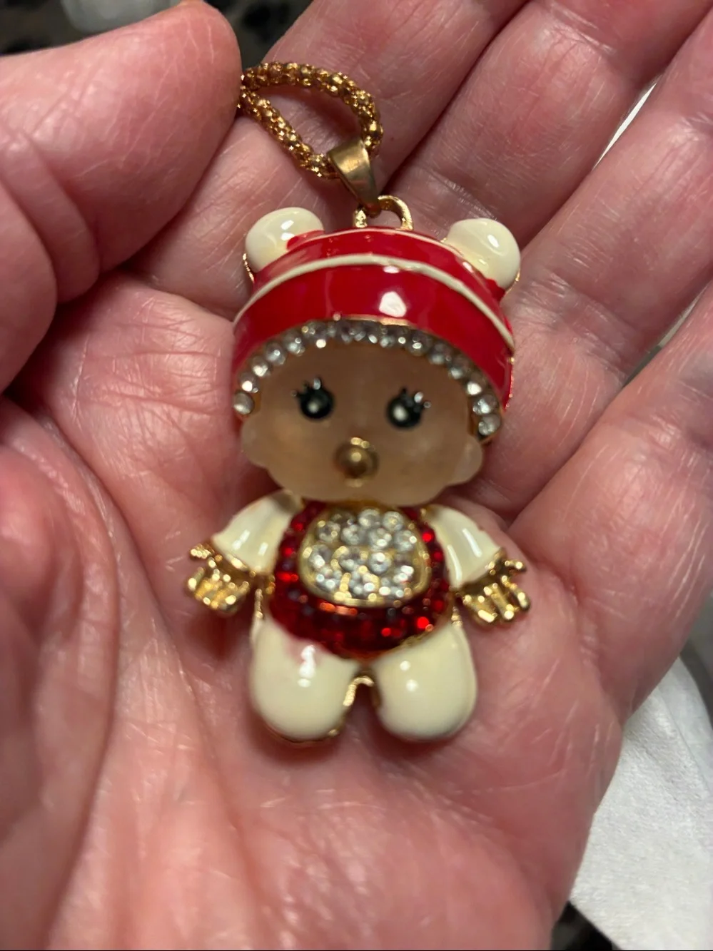 Moveable baby girl Pendant Necklace in Red, Cream & Gold